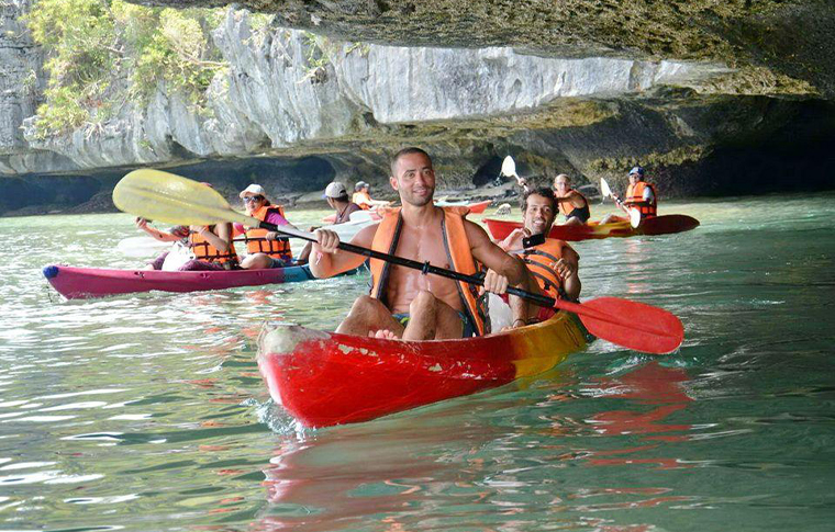 Group of kayakers quietly paddling around a group of islands